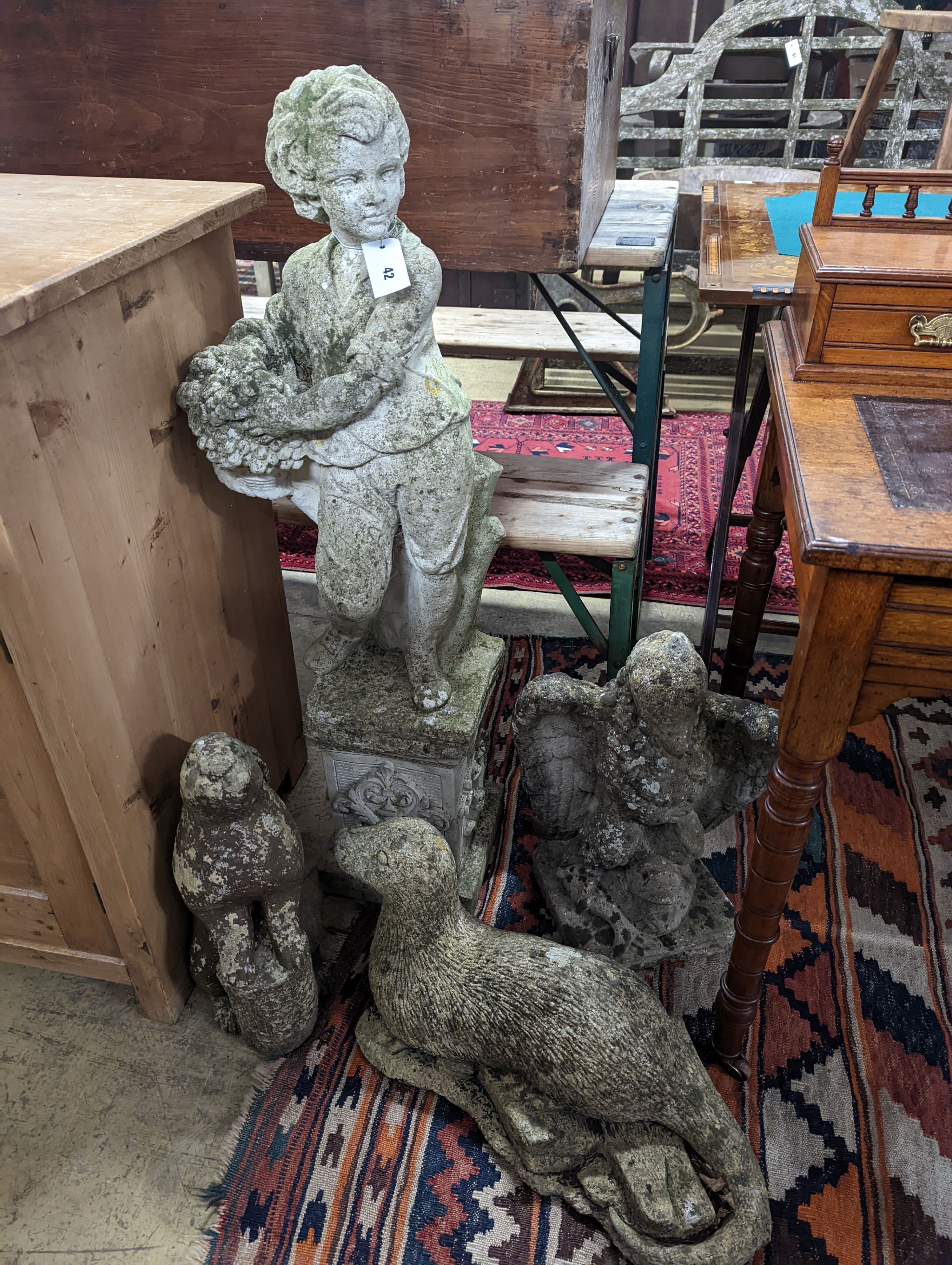 Four reconstituted stone garden ornaments modelled as a flower seller, height 102cm, hare, seal and eagle